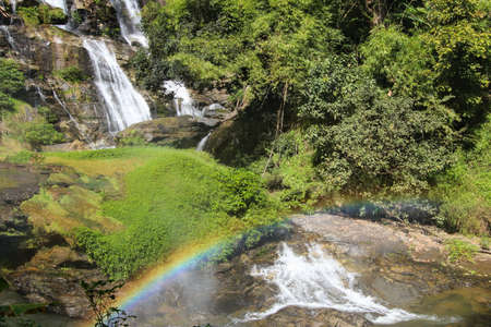 Small waterfall in Thailand with rainbow.の写真素材