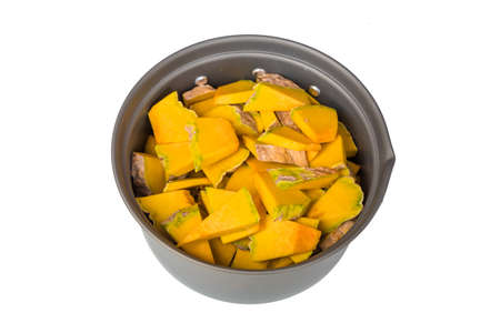Sliced raw yellow pumpkin in pot.の写真素材