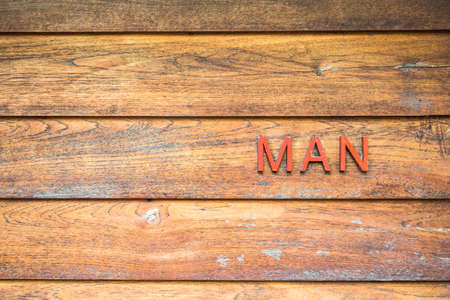Man toliet sign on wooden background.の写真素材