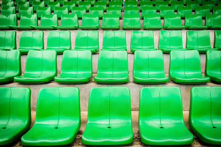 plastic green seats on football stadiumの写真素材