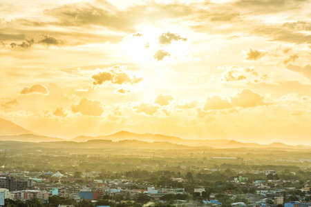 Briliant golden sunset over Hadyai City, Thailand on cloudy day in summer.の写真素材