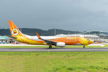 PHUKET INTERNATIONAL AIRPORT, PHUKET, THAILAND - JUNE 1, 2016: NOK Airways Boeing 737 flight is taking off and fly from Phuket International airport to Donmuang Intenational Airport.のeditorial素材