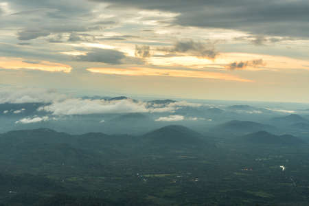 Mountain valley under mist and sunshine in the morning.の写真素材