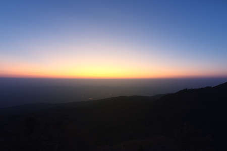 Great sunset above the mountain valley and morning mist.の写真素材