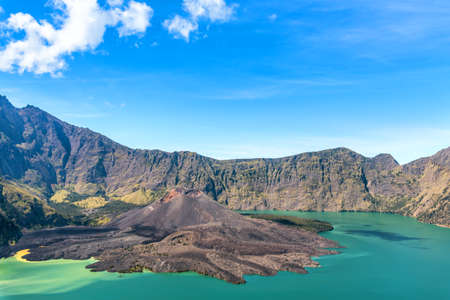 landscape of active volcano Baru Jari, Lake Segara Anak and summit of Rinjani mountain. Lombok island, Indonesia.の写真素材