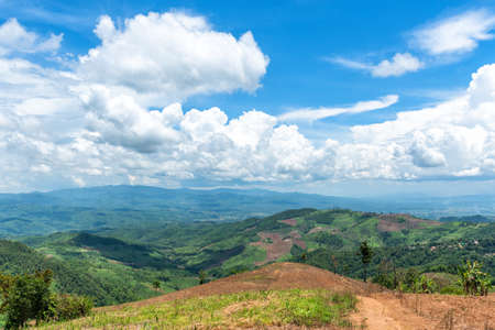 Mountain forest valley and cloud blue sky. Doi chang in Chiang Rai, Thailand.の写真素材