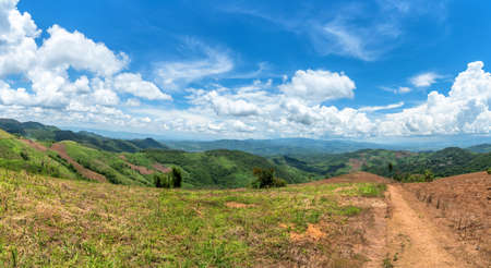 Mountain forest valley and cloud blue sky. Doi chang in Chiang Rai, Thailand.の写真素材