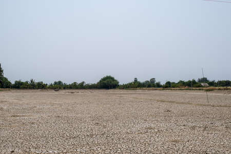 Crack soil on dry season, Global warming / cracked dried mud / Dry cracked earth background / The cracked ground, Ground in drought, Soil texture and dry mud, Dry land.の写真素材