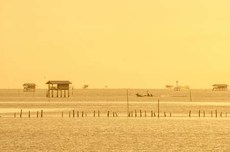 Sunrise time Thai fisherman village in Bangtaboon Petchaburi, Thailand