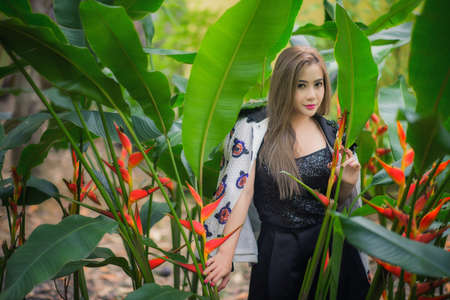 portrait of a beautiful fashion girl wear traditional in treeの写真素材