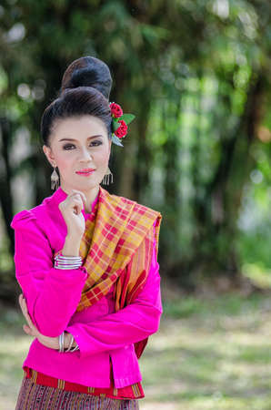 Beautiful Thai girl in Thai dress identity  traditional costume, culture of Thailandの写真素材