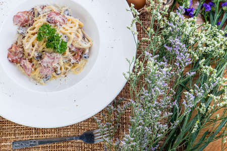 Pasta carbonara. Spaghetti with bacon and parmesan cheese greensの写真素材