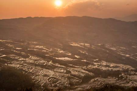 Sunrise at Yuanyang rice terrace from yuanyang village, Yunnan province, Chinaの写真素材