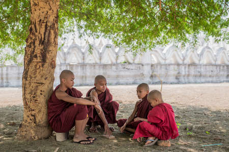 MYANMAR The novice monk walking on the white pagoda in Mandalay Myanmarのeditorial素材