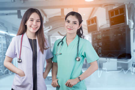 Doctor with a stethoscope in the hands and Operating room background, Modern medical technology and innovation conceptの写真素材