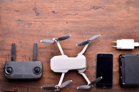 Hobby Racing drone concept. Drone equipment, remote controller, video receiver, charger, mobile and...