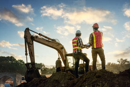Engineers discussion with architects work planing in construction site
