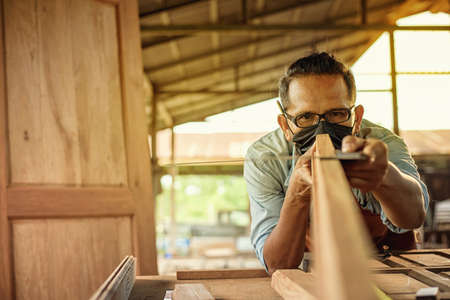 Carpenter Woodwork and furniture making in carpentry workshop