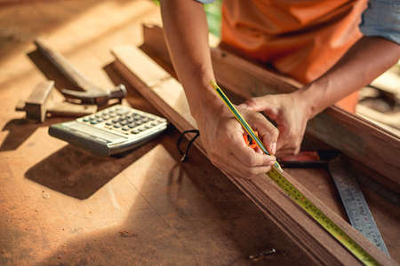 Carpenter Woodwork and furniture making in carpentry workshopの写真素材