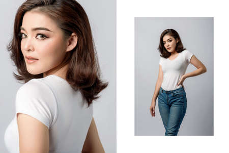 Beautiful female model . High fashion portraitÂ sits in a light studio, isolated on white...
