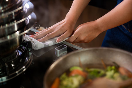 asian woman cooking at kitchen her beautiful parents cooking together in kitchen at homeの写真素材
