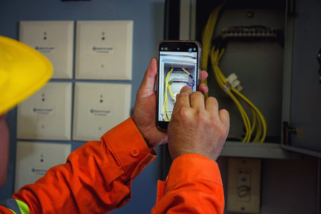 electrical engineer using tablet checking and serviceの写真素材