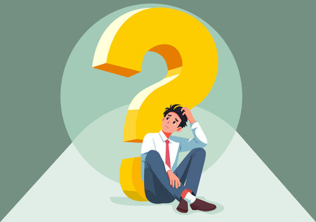 A young man sits confusedly next to a question mark.のイラスト素材