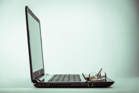 Eyeglasse on Laptop computer.の写真素材