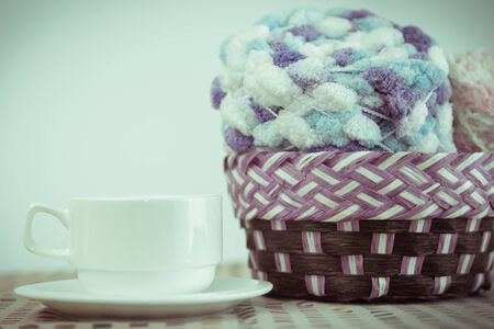 Cup of coffee and Knitting yarn balls.の写真素材