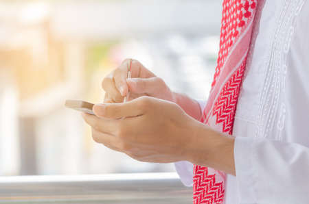 Arab business man wring message on smart phone for business connection,technology.
