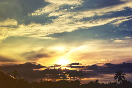 silhouette of tropical city during sunset time.の写真素材
