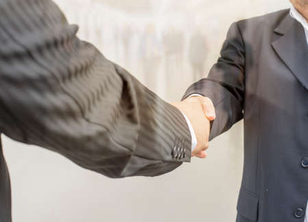 business handshakes, with double exposureの写真素材