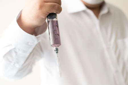 a doctor with a needleの写真素材