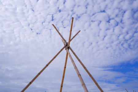 Bamboo arch with sky and clouds view on a bright day.の写真素材