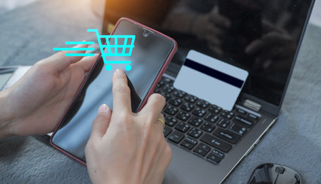 Woman using credit card filling billing information on laptop computer shopping in ecommerce store. concept : online payment, accessible internet money transactionの写真素材