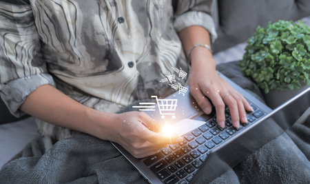 Woman using credit card filling billing information on laptop computer shopping in ecommerce store. concept : online payment, accessible internet money transactionの写真素材
