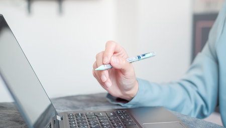 Woman typing work on laptop Suitable for making infographics.