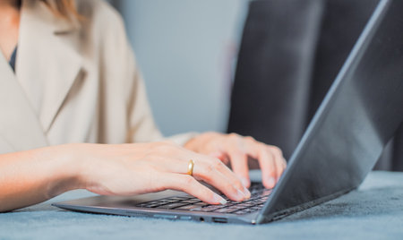 Woman typing work or chatting on laptop Suitable for making infographics.