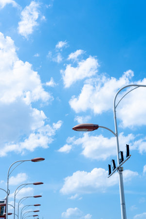 The atmosphere of the bright blue sky and light polesの写真素材