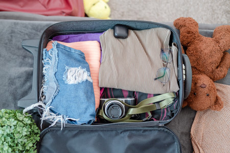 arrangement of clothes and accessories in a suitcase,Travel concept.
