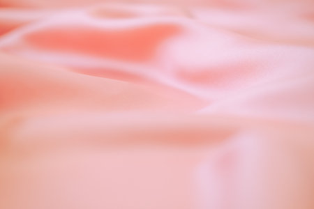 Stylish bright orange fabric stripes, blurred backgroundの写真素材