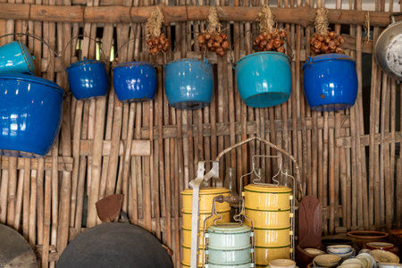 Food containers and pots in the walls of a traditional Asian kitchen.の写真素材