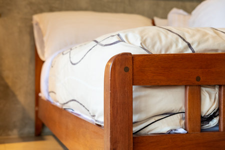 Wooden bed with soft and comfortable mattress