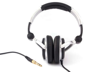 Headphones with gold plug on white backgroundの写真素材