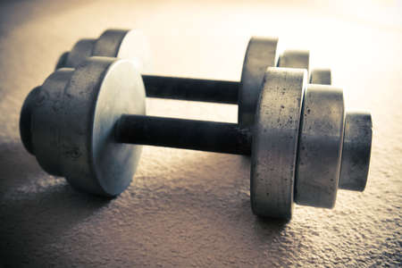 Dumbbells. Yellow and blue tint.の写真素材