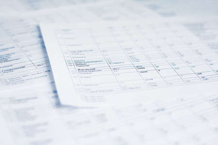 Sheets of peper with table. Shallow dof.