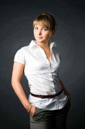 Young woman on dark background.の写真素材