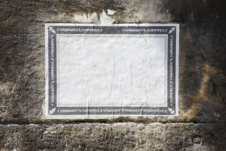 Old blank paper on a wall.の写真素材