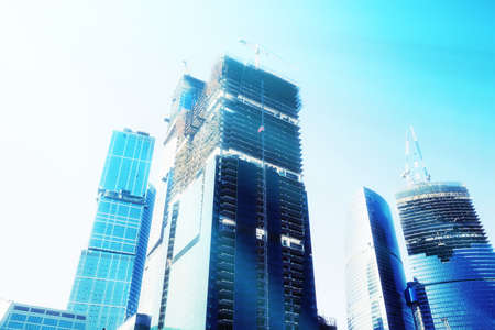 Futuristic skyscrapers. Blue tint and sun shine effect.