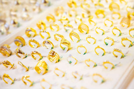 Golden rings in a shopwindow. Shallow dof.の写真素材